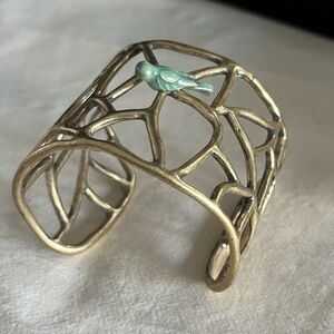 Eclectic statement piece wide cuff bracelet- with pottery bird accent detail.